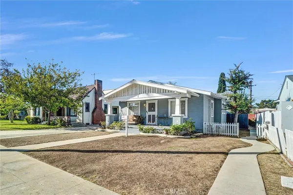 front view of a house with a yard