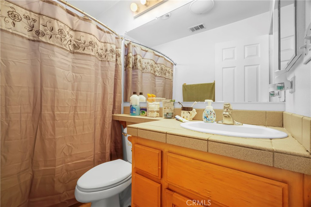 833 South Lemon Street Anaheim, CA 92805 - Photo 39 of 49 a bathroom with a sink a toilet and shower