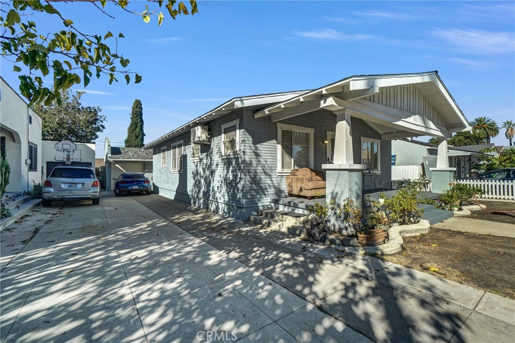 833 South Lemon Street Anaheim, CA 92805 - Photo 4 of 49 a front view of a house with a yard