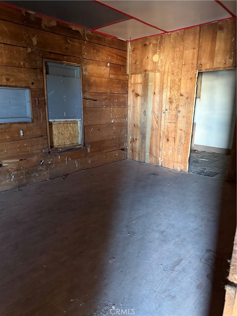 406 D Street Needles, CA 92363 - Photo 4 of 16 a view of empty room with wooden floor and fan