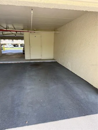 a view of parking and utility room
