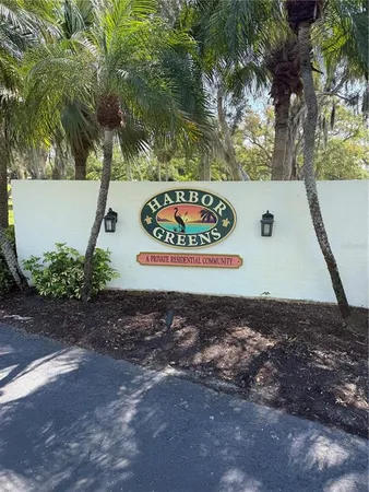 a view of a sign board with yard