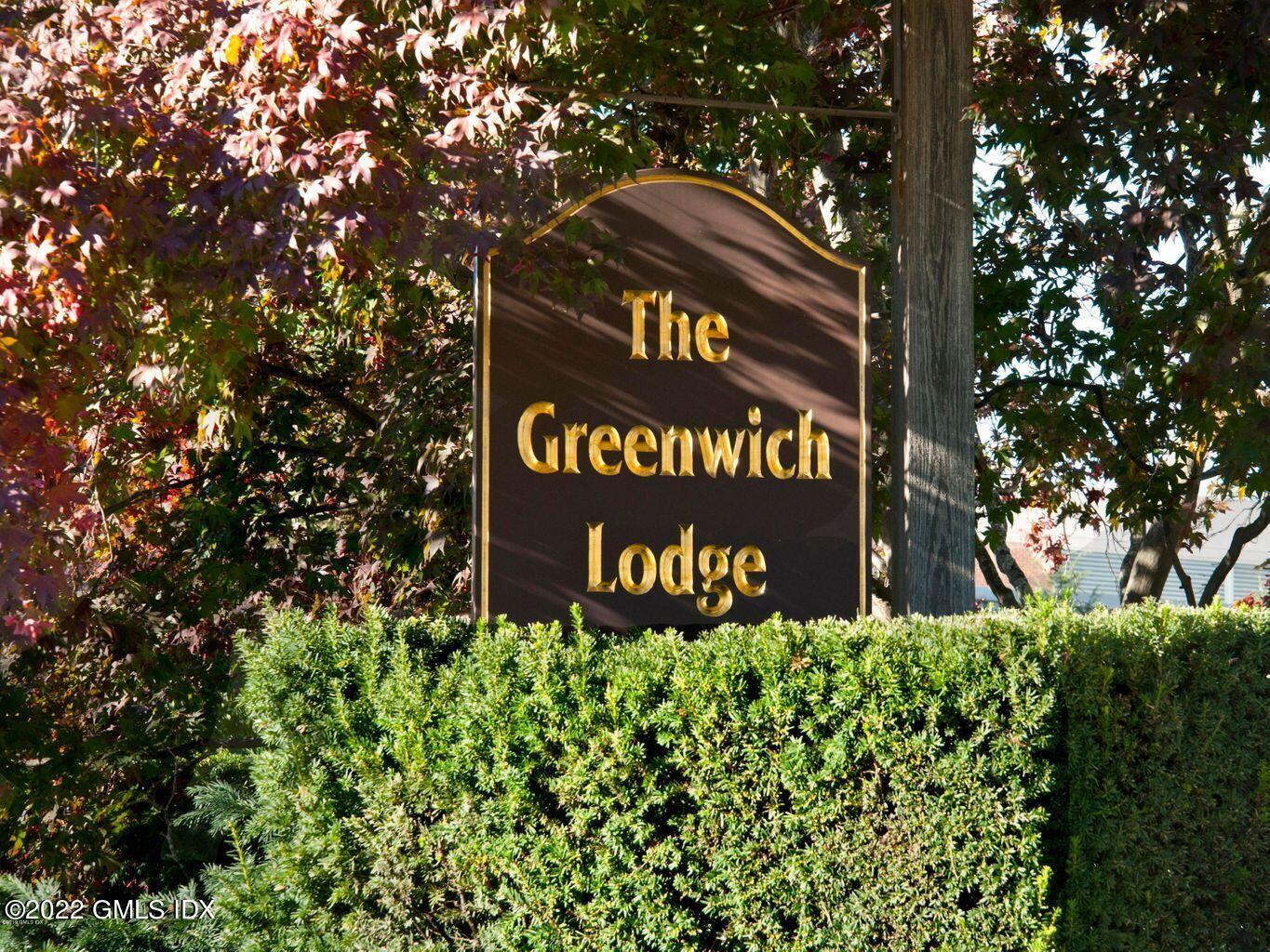 47 Lafayette Place, Unit 3H Greenwich, CT 06830 - Photo 13 of 13 a sign that is sitting in front of a tree