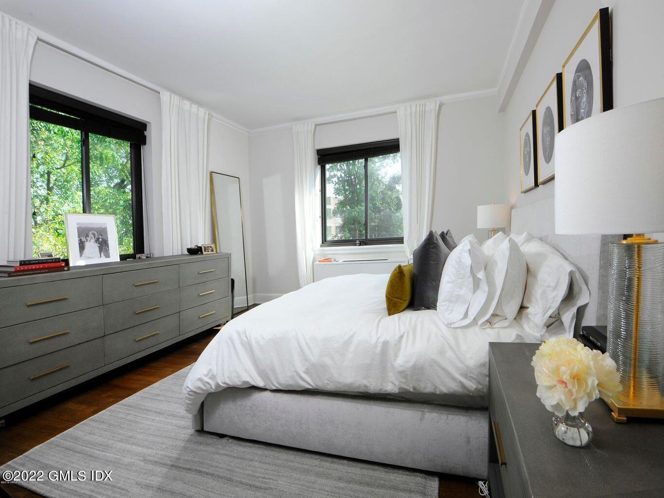 47 Lafayette Place, Unit 3H Greenwich, CT 06830 - Photo 9 of 13 a bedroom with a bed and window