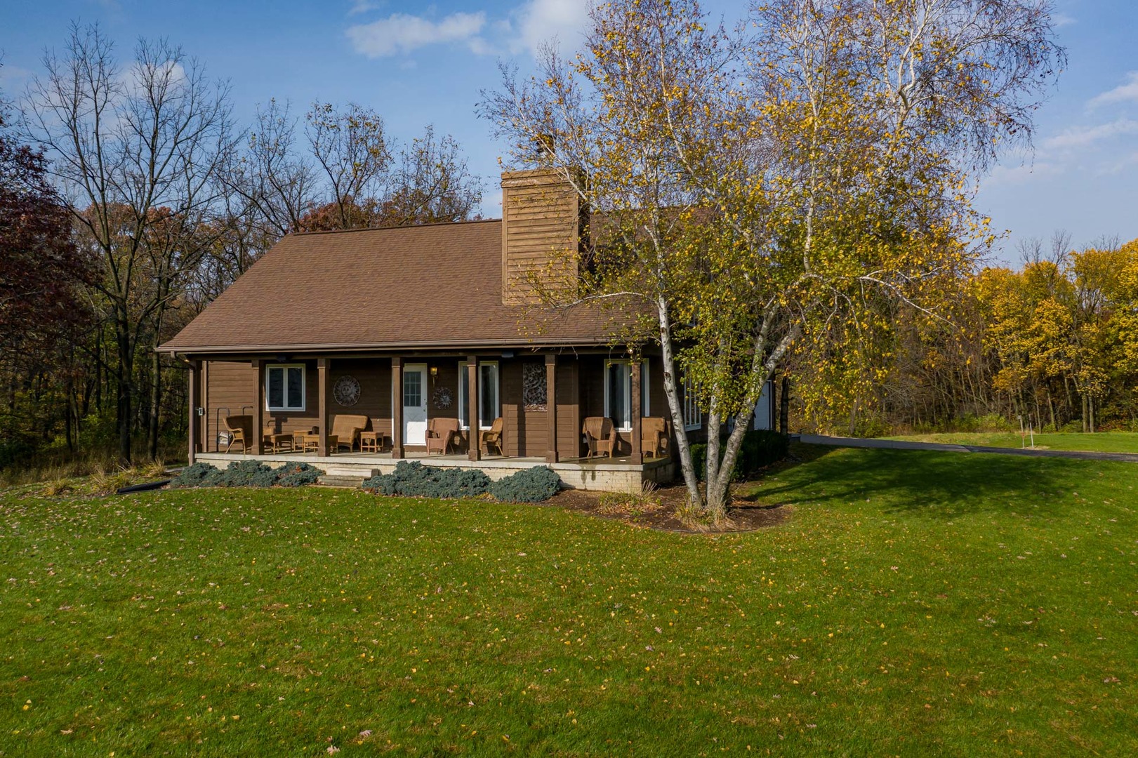 17501 Bishop Road Morrison, IL 61270 - Photo 2 of 167 a front view of a house with garden and trees