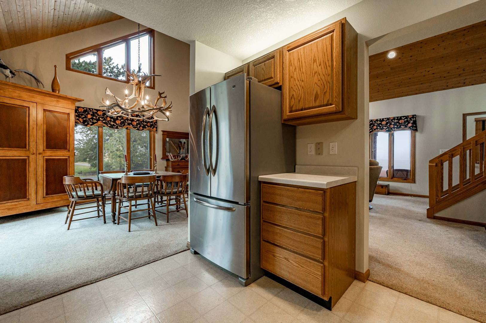 17501 Bishop Road Morrison, IL 61270 - Photo 79 of 167 a kitchen with refrigerator cabinets and dining table