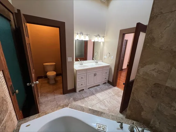 a bathroom with a bathtub and shower