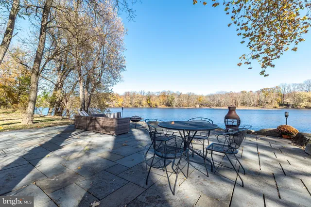 an outdoor space with patio and ocean view