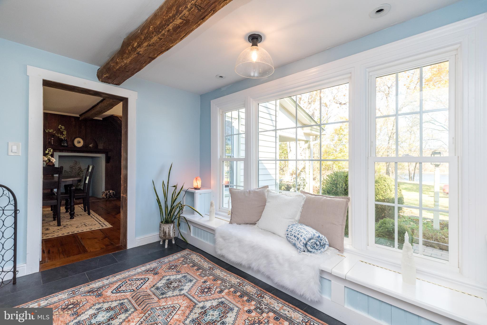 1442 River Road Upper Black Eddy, PA 18972 - Photo 26 of 65 a living room with furniture and a floor to ceiling window