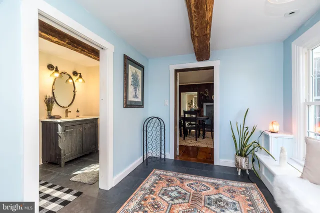a bedroom with a baby bed baby crib and a window