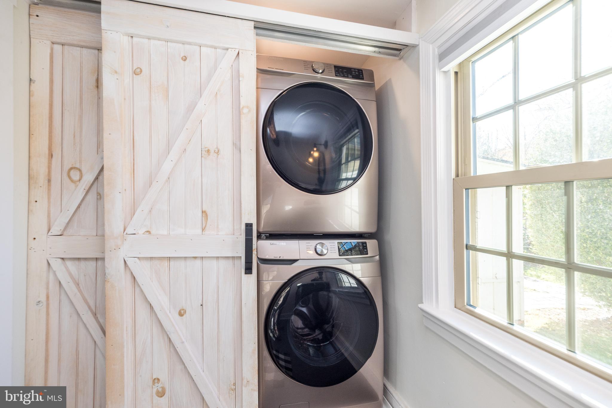 1442 River Road Upper Black Eddy, PA 18972 - Photo 29 of 65 a view of a hallway with washer and dryer