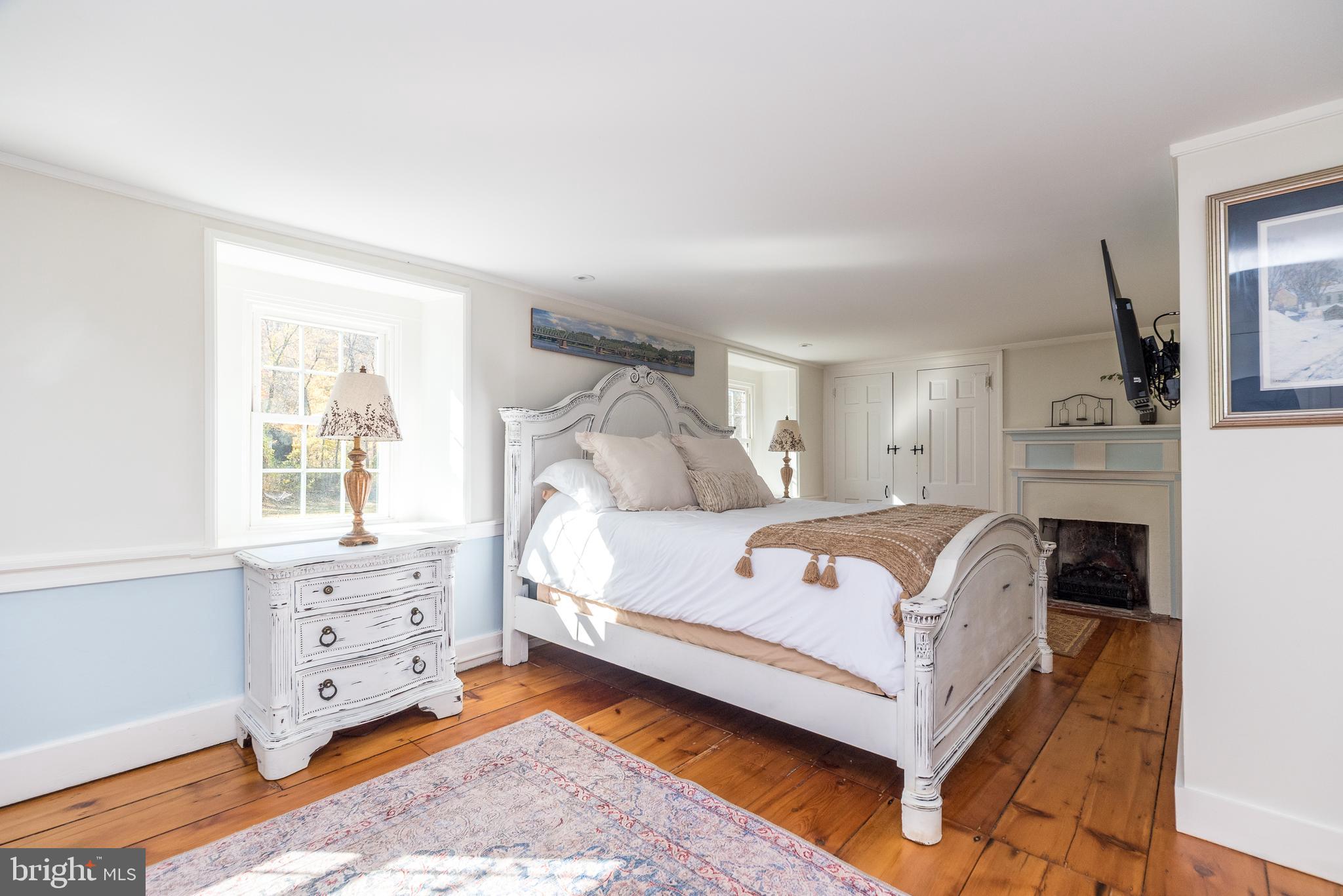 1442 River Road Upper Black Eddy, PA 18972 - Photo 30 of 65 a bedroom with a bed and a window