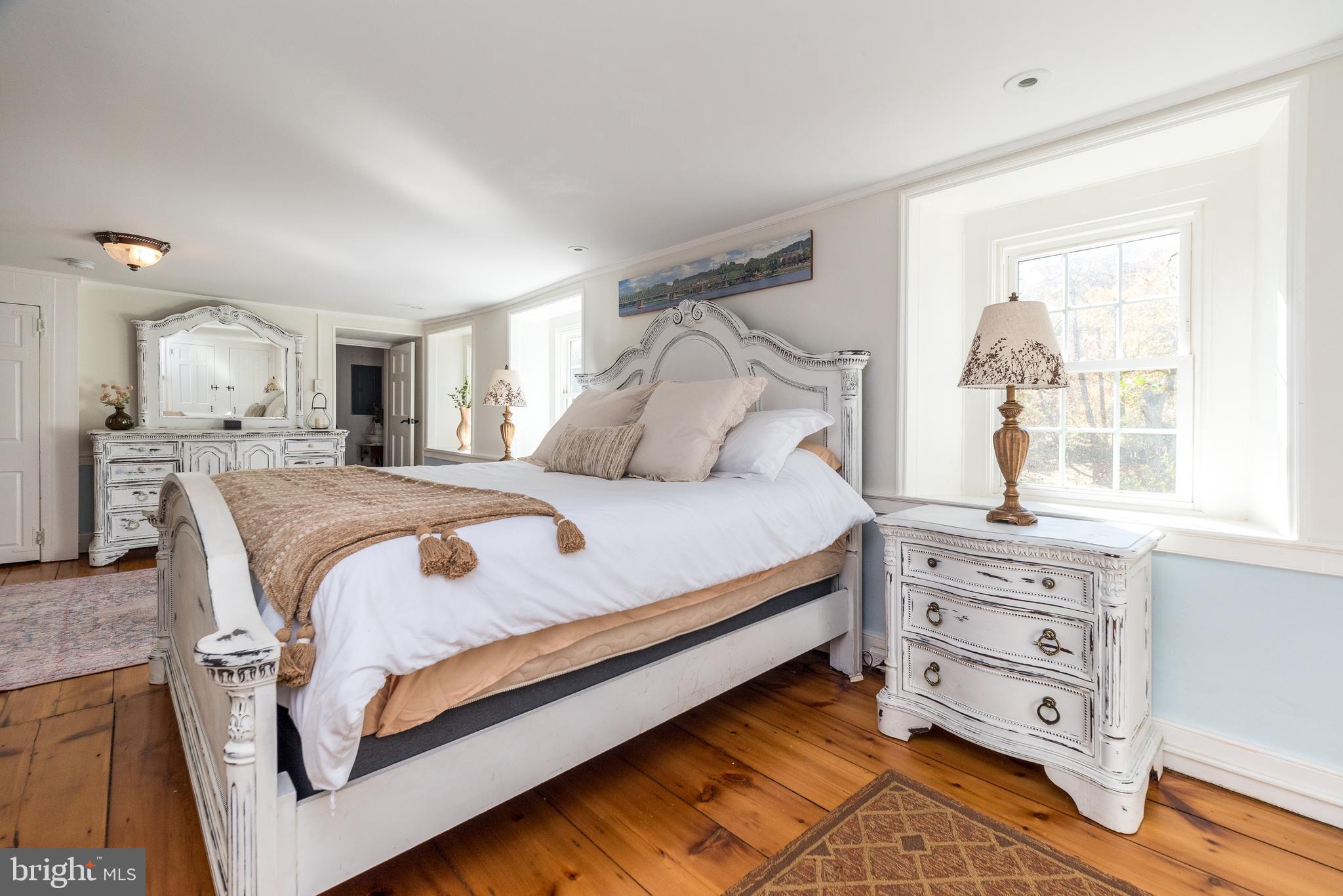 1442 River Road Upper Black Eddy, PA 18972 - Photo 33 of 65 a bedroom with a bed and a window