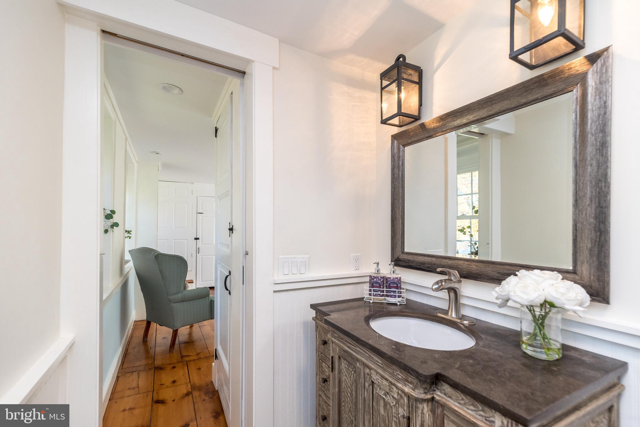 1442 River Road Upper Black Eddy, PA 18972 - Photo 35 of 65 a bathroom with a sink and a mirror