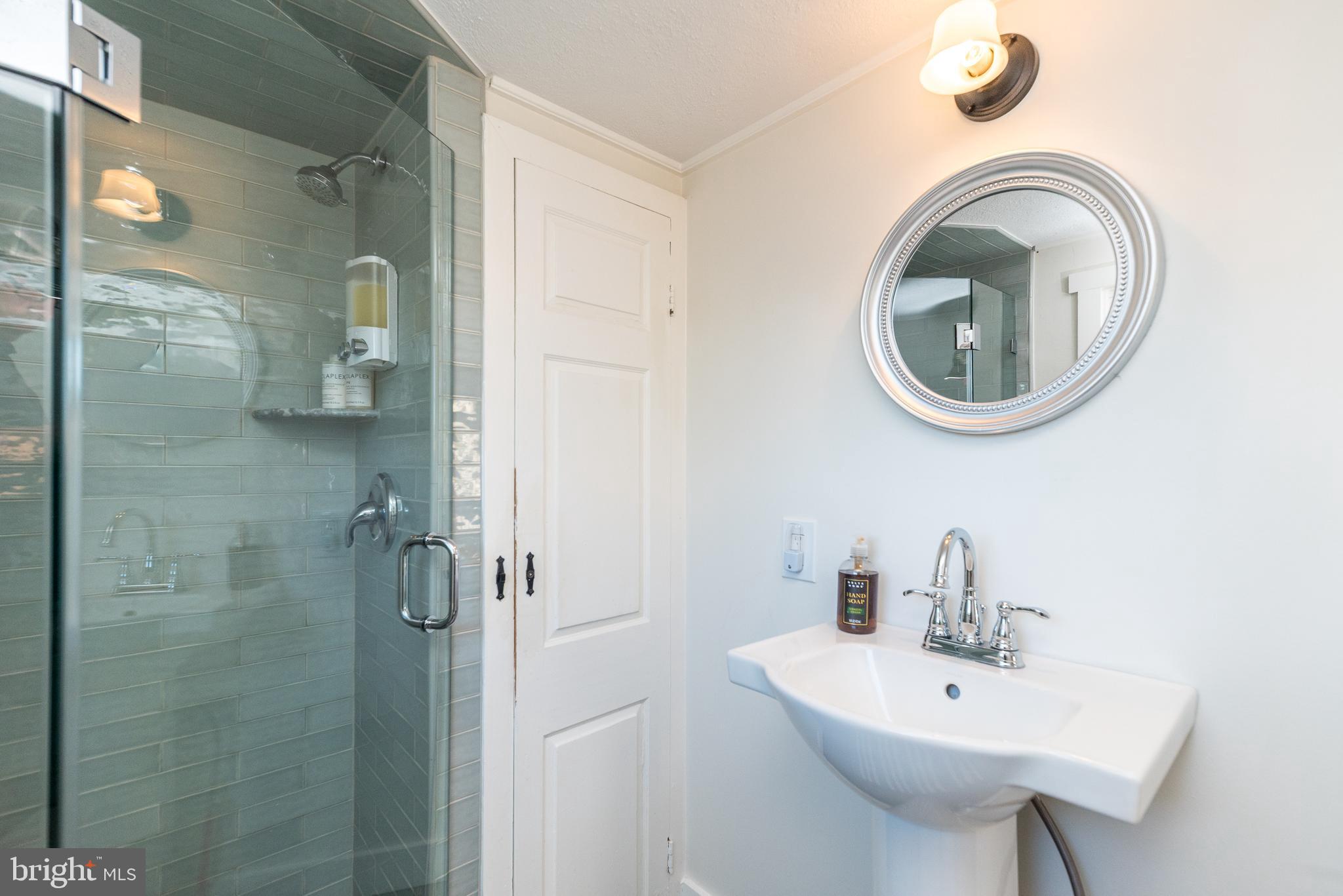 1442 River Road Upper Black Eddy, PA 18972 - Photo 38 of 65 a bathroom with a sink a toilet and shower
