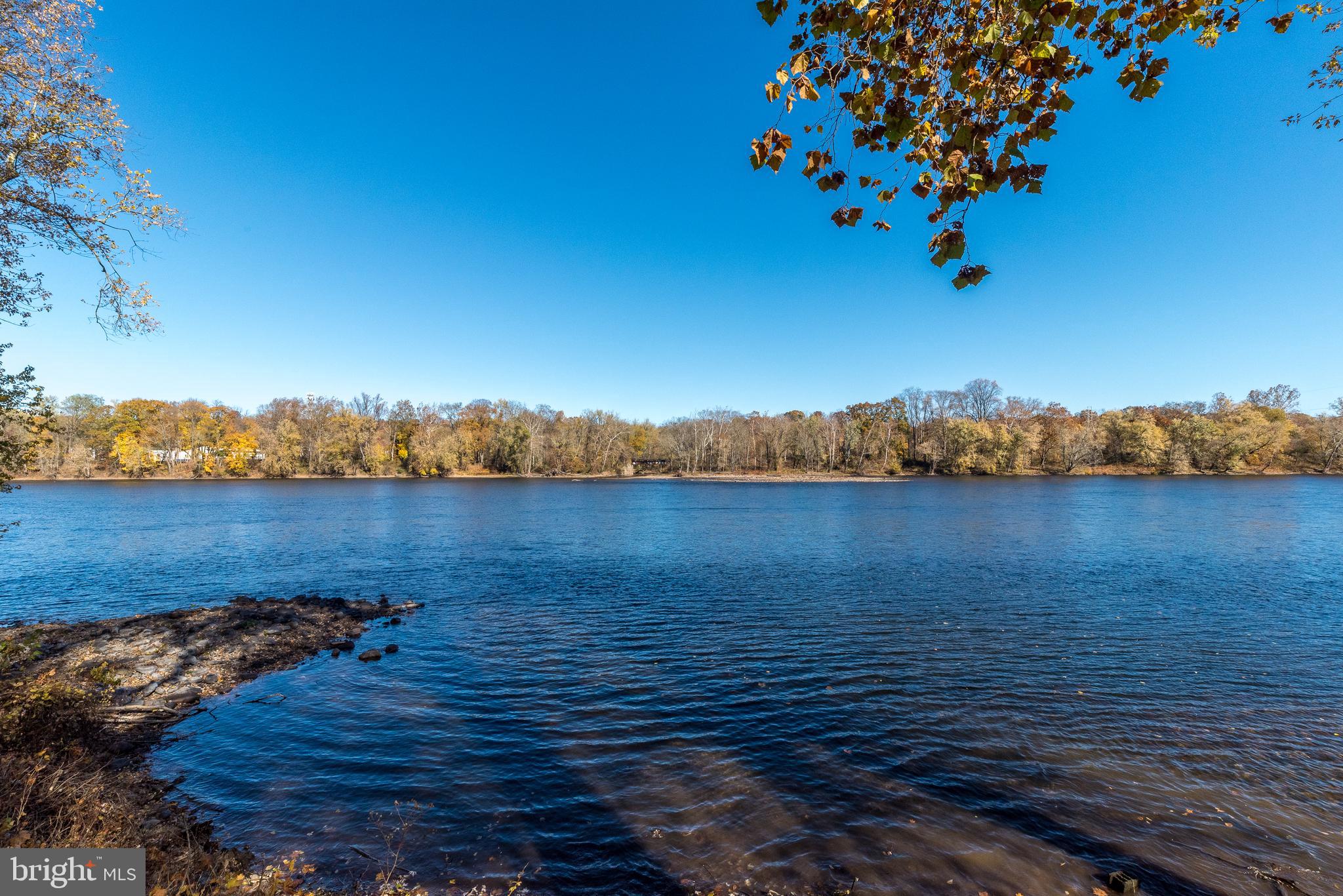 1442 River Road Upper Black Eddy, PA 18972 - Photo 45 of 65 a view of a lake with houses in the back