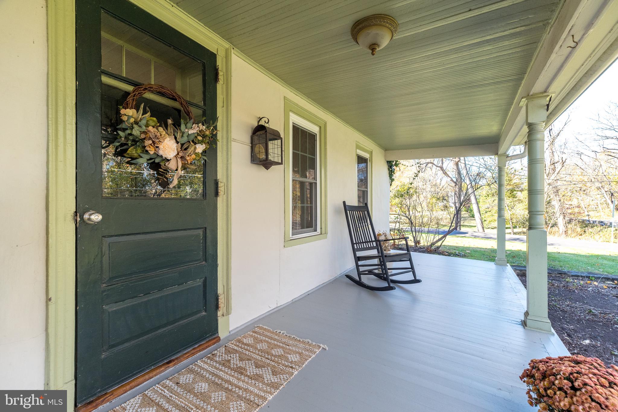 1442 River Road Upper Black Eddy, PA 18972 - Photo 5 of 65 a view of a hallway with wooden floor and windows