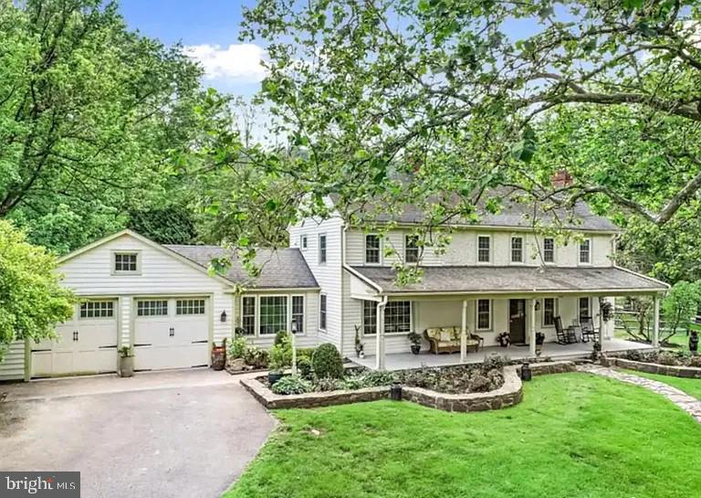1442 River Road Upper Black Eddy, PA 18972 - Photo 62 of 65 a front view of a house with garden and porch