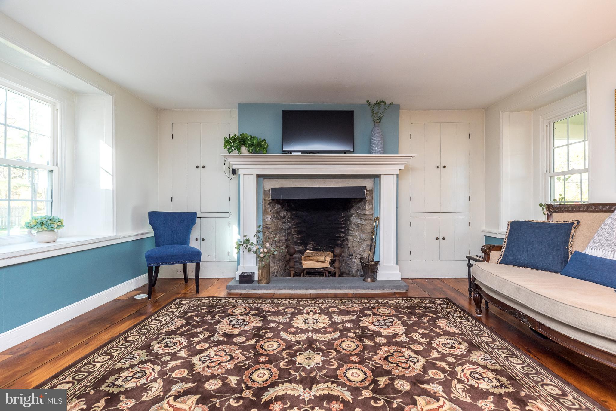 1442 River Road Upper Black Eddy, PA 18972 - Photo 8 of 65 a living room with furniture and a fireplace