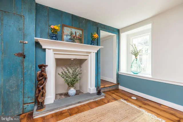 a view of an entryway with wooden floor