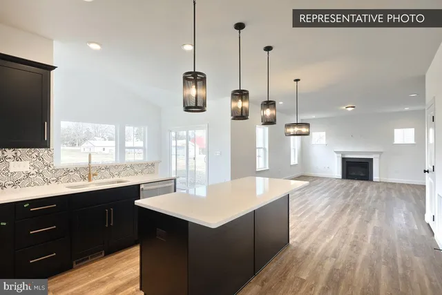 a kitchen with kitchen island sink refrigerator and window