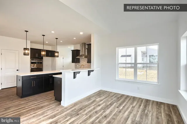 a view of kitchen with wooden floor