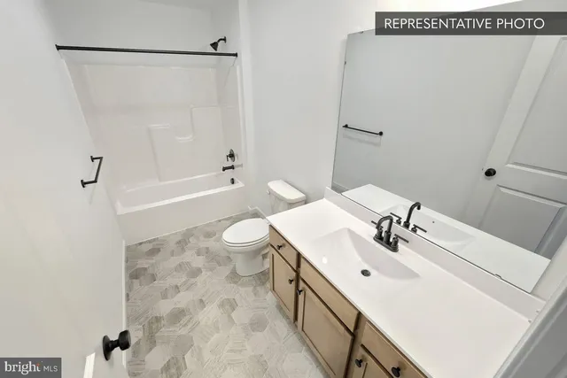 a bathroom with a sink a toilet and a bathtub