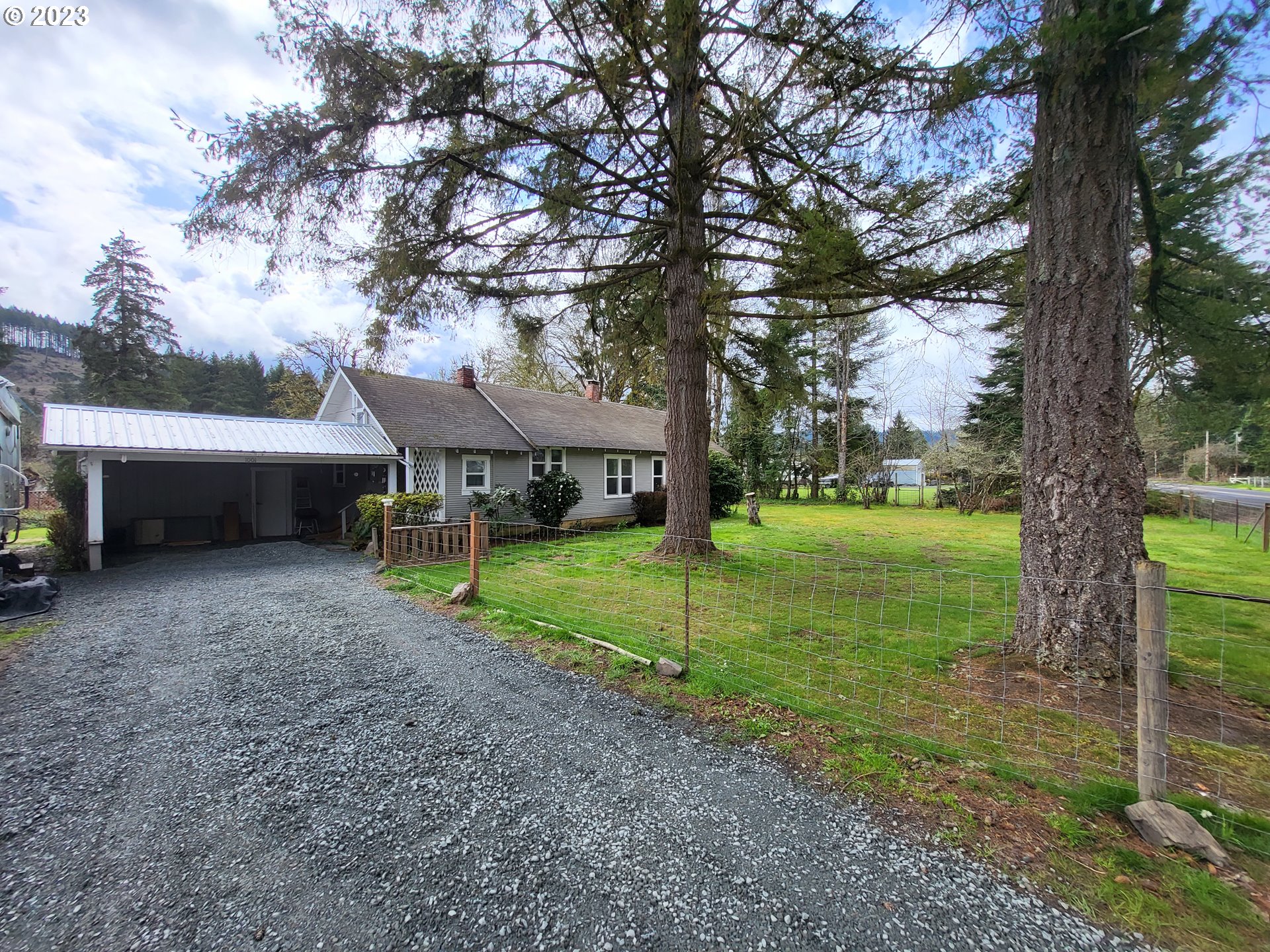 1001 Curtin Road Cottage Grove, OR 97424 - Photo 2 of 24 a view of a house with a yard