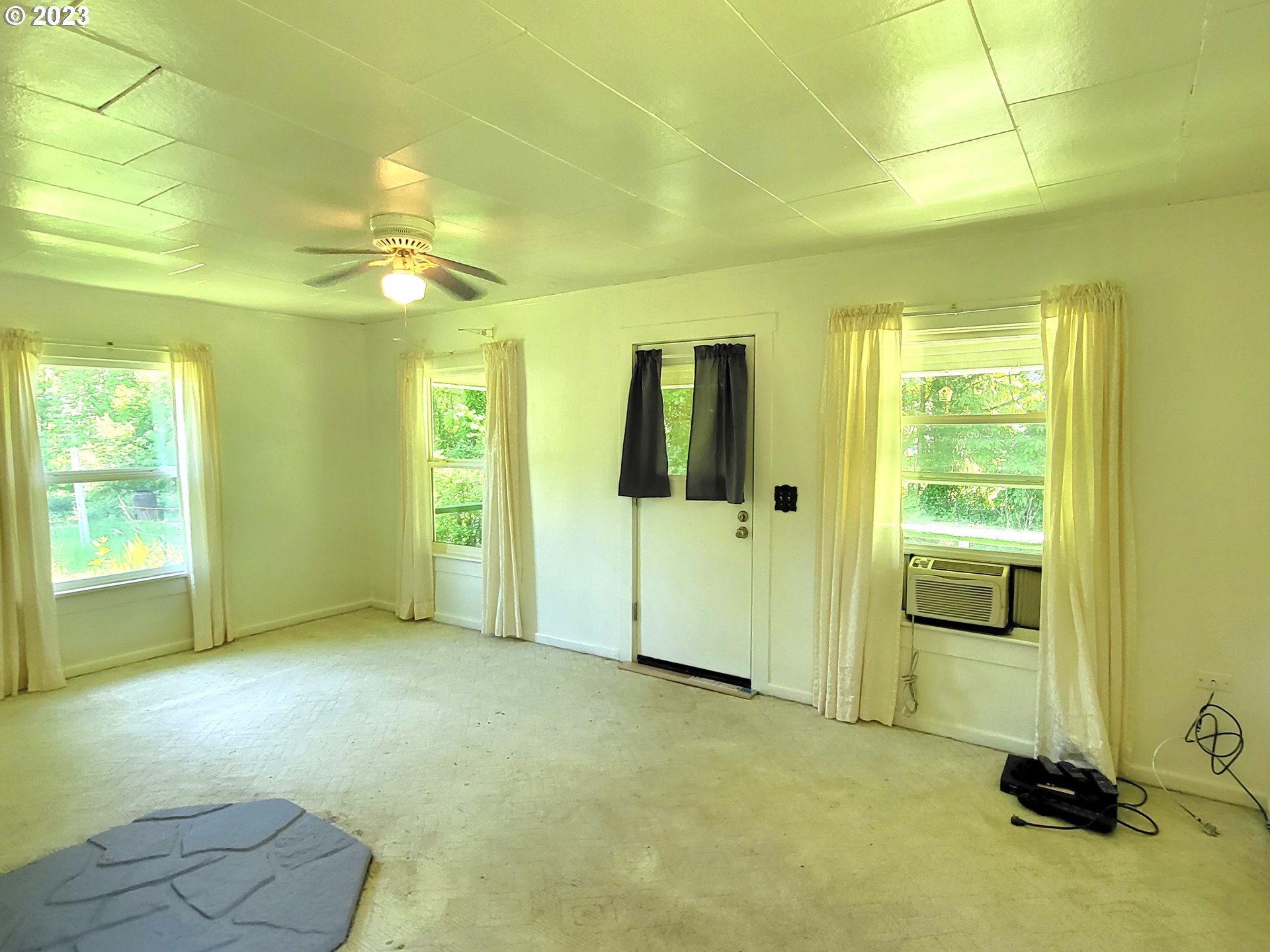 1001 Curtin Road Cottage Grove, OR 97424 - Photo 7 of 24 a view of an empty room with a window