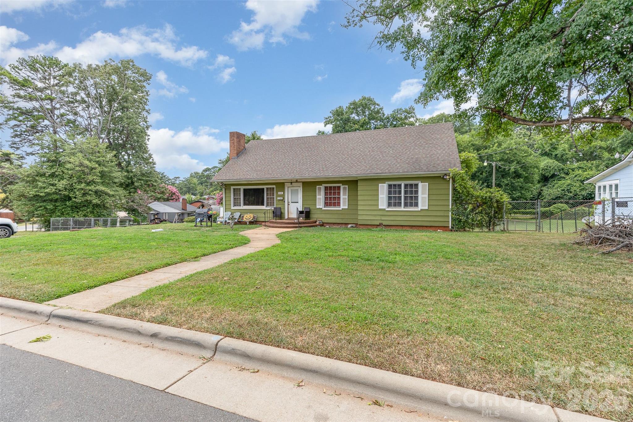 1318 Enderly Road Charlotte, NC 28208 - Photo 2 of 33 a house view with swimming pool and garden space