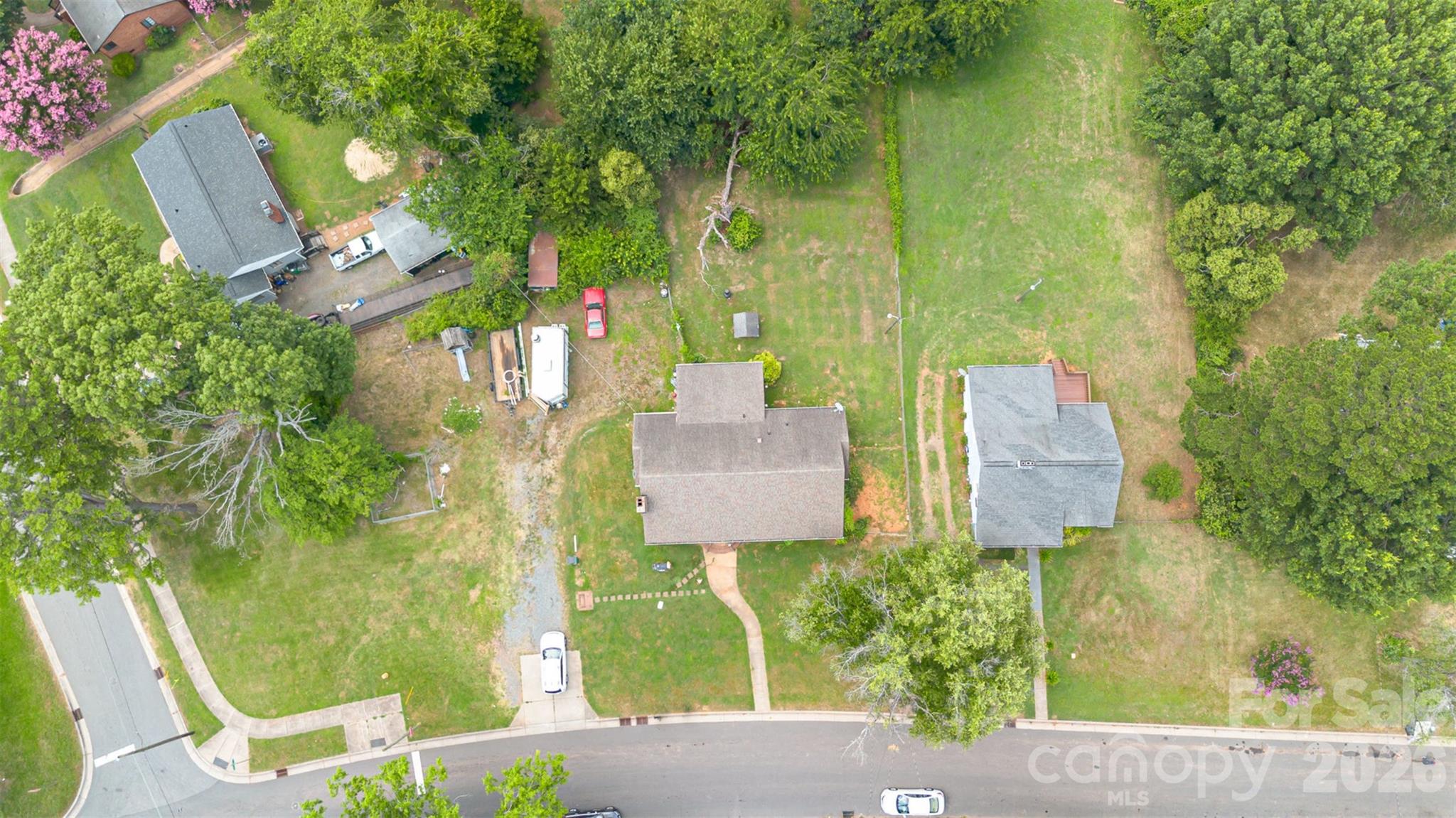 1318 Enderly Road Charlotte, NC 28208 - Photo 21 of 33 an aerial view of residential house with outdoor space and trees all around