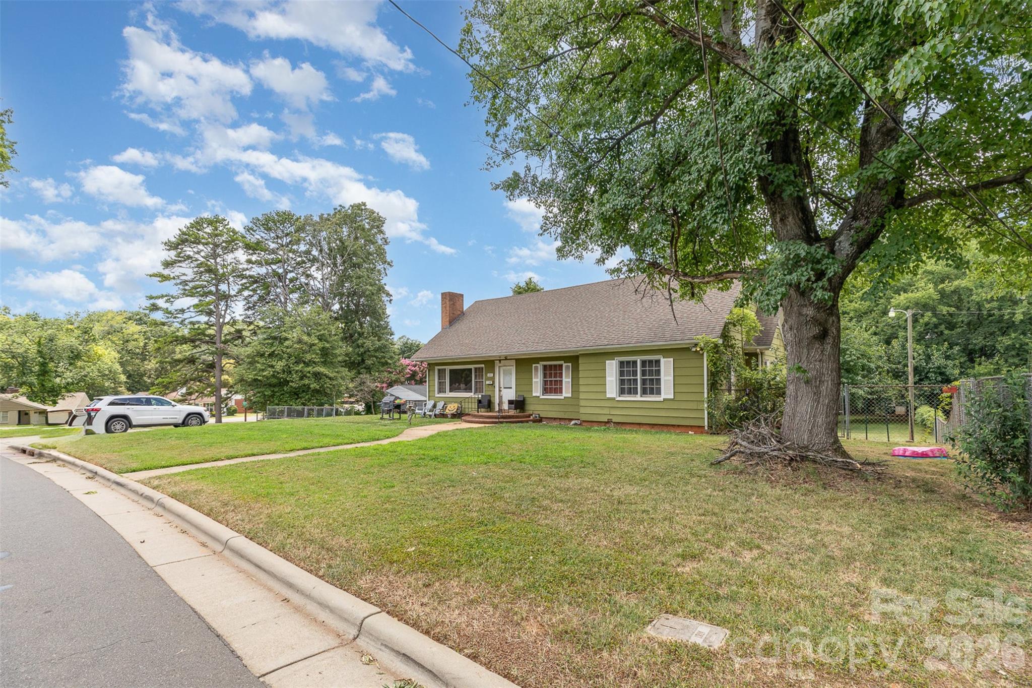 1318 Enderly Road Charlotte, NC 28208 - Photo 3 of 33 a front view of a house with a yard