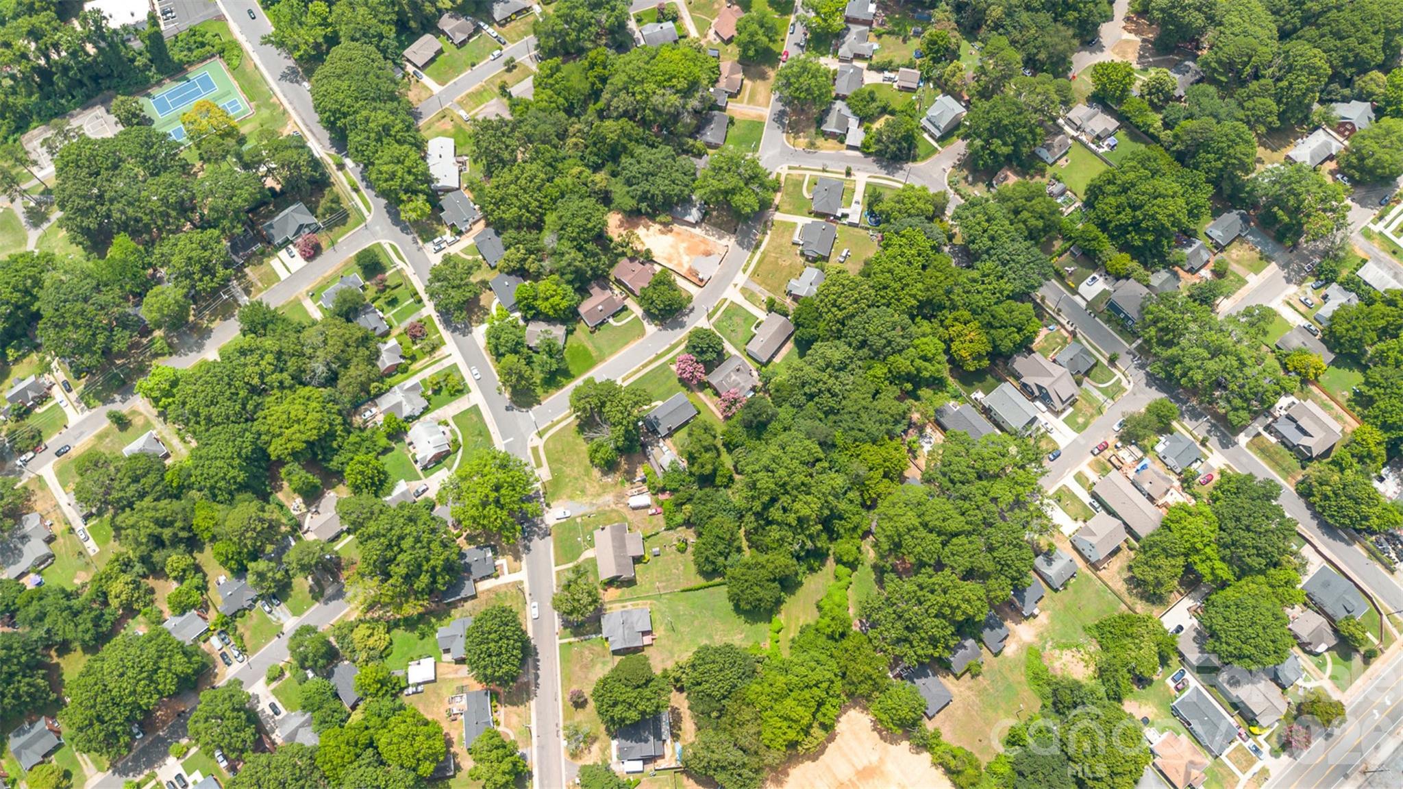 1318 Enderly Road Charlotte, NC 28208 - Photo 31 of 33 a backyard of a house with lots of trees