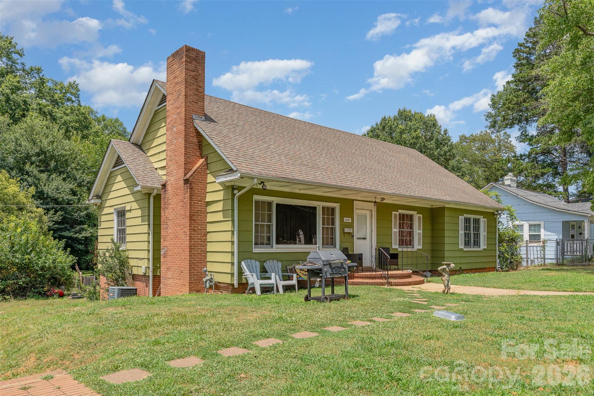 1318 Enderly Road Charlotte, NC 28208 - Photo 5 of 33 a backyard of a house with table and chairs
