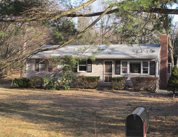 94 Boxford Road Rowley, MA 01969 - Photo 14 of 14 a front view of a house with yard and trees in the background