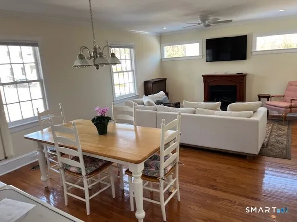 a view of a dining room with furniture window and wooden floor