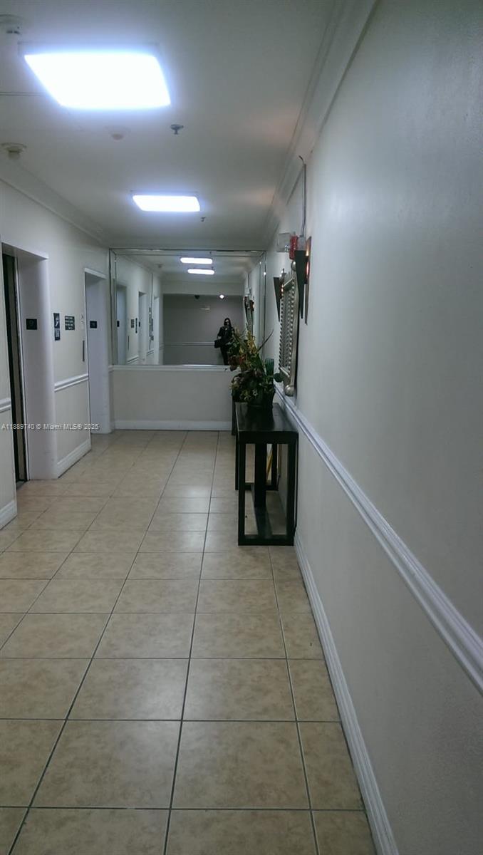 6345 Collins Avenue, Unit 937 Miami Beach, FL 33141 - Photo 16 of 27 a view of hallway with furniture and a window