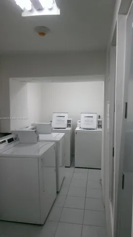 a white refrigerator freezer sitting inside of a kitchen