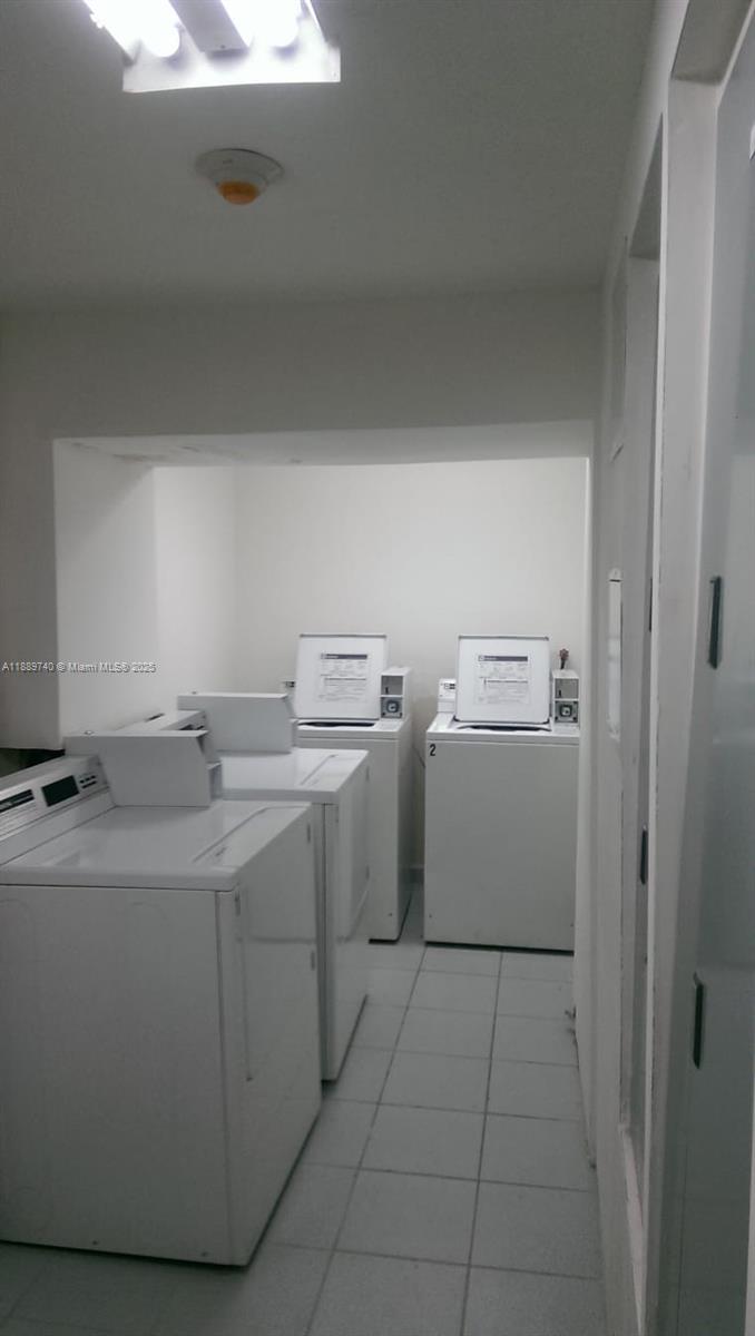 6345 Collins Avenue, Unit 937 Miami Beach, FL 33141 - Photo 23 of 27 a utility room with dryer and washer