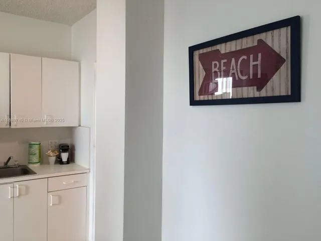 a room with window and walk in closet