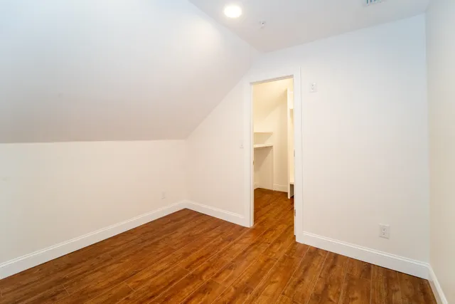 a view of wooden floor in an empty room