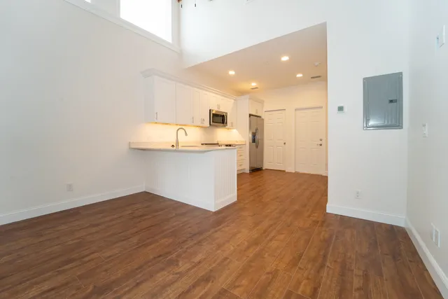 a view of kitchen with wooden floor