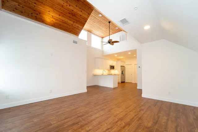 a view of a living room with a wooden floor