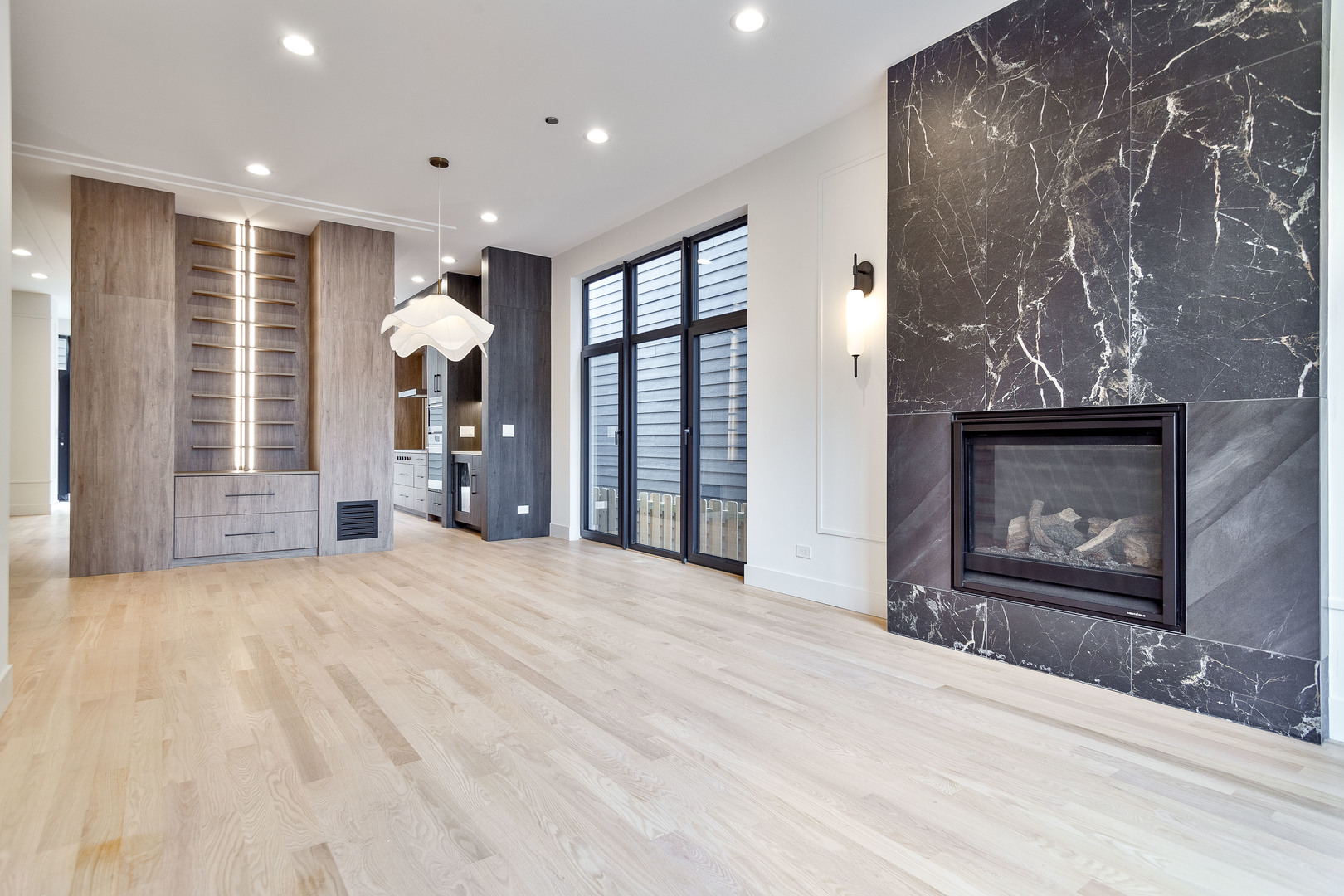 2055 West Race Avenue Chicago, IL 60612 - Photo 12 of 36 a view of an empty room with a fireplace and a window