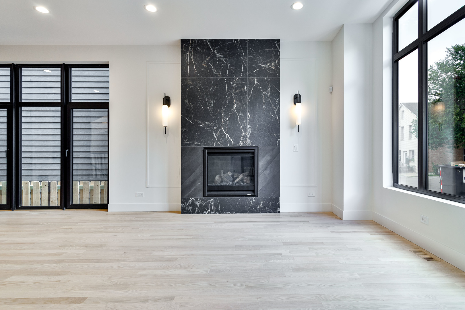 2055 West Race Avenue Chicago, IL 60612 - Photo 13 of 36 a view of an empty room with a fireplace and a window