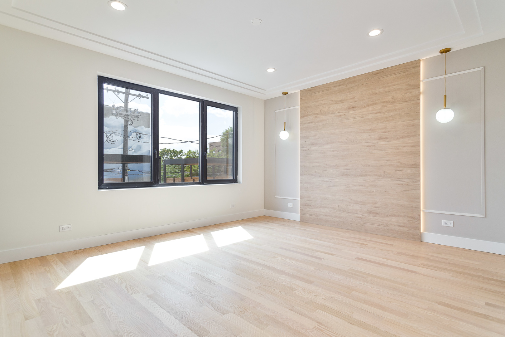 2055 West Race Avenue Chicago, IL 60612 - Photo 15 of 36 a view of an empty room with wooden floor and a window