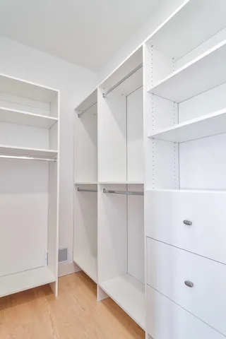a view of an empty walk in closet