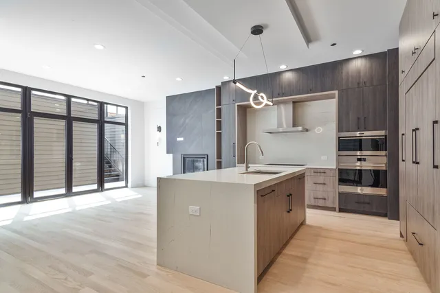a kitchen with a stove and a refrigerator