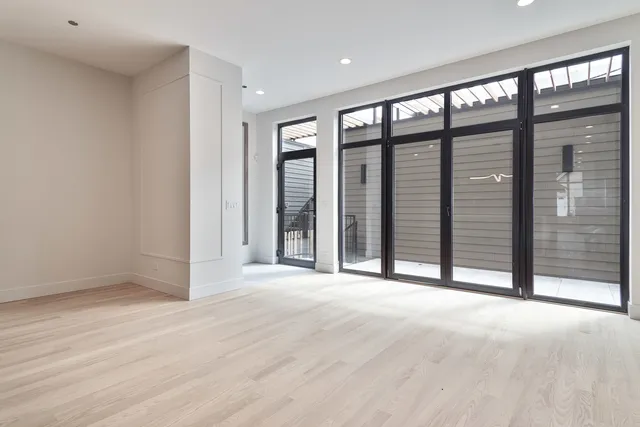 a view of an empty room with a balcony