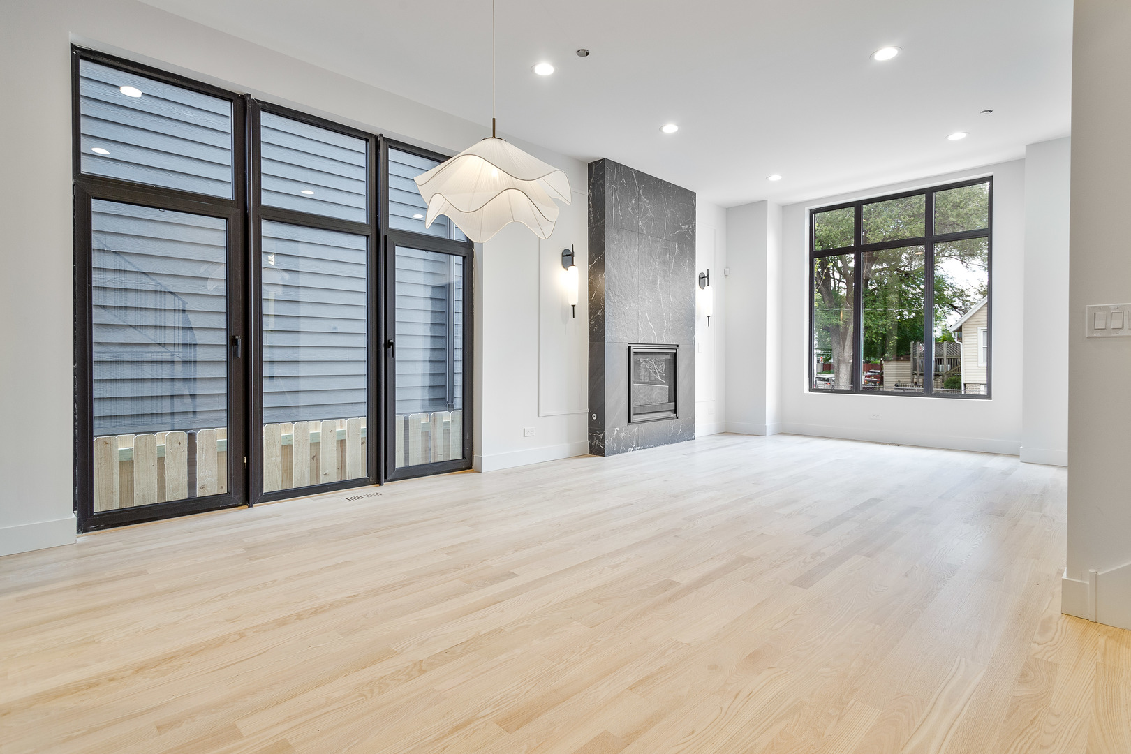 2055 West Race Avenue Chicago, IL 60612 - Photo 9 of 36 a view of an empty room with a window and kitchen view